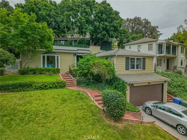 front view of a house with a yard