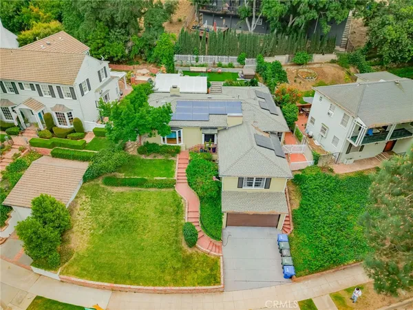 an aerial view of a house with a garden