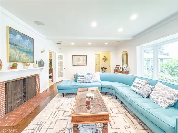 a living room with furniture and a rug