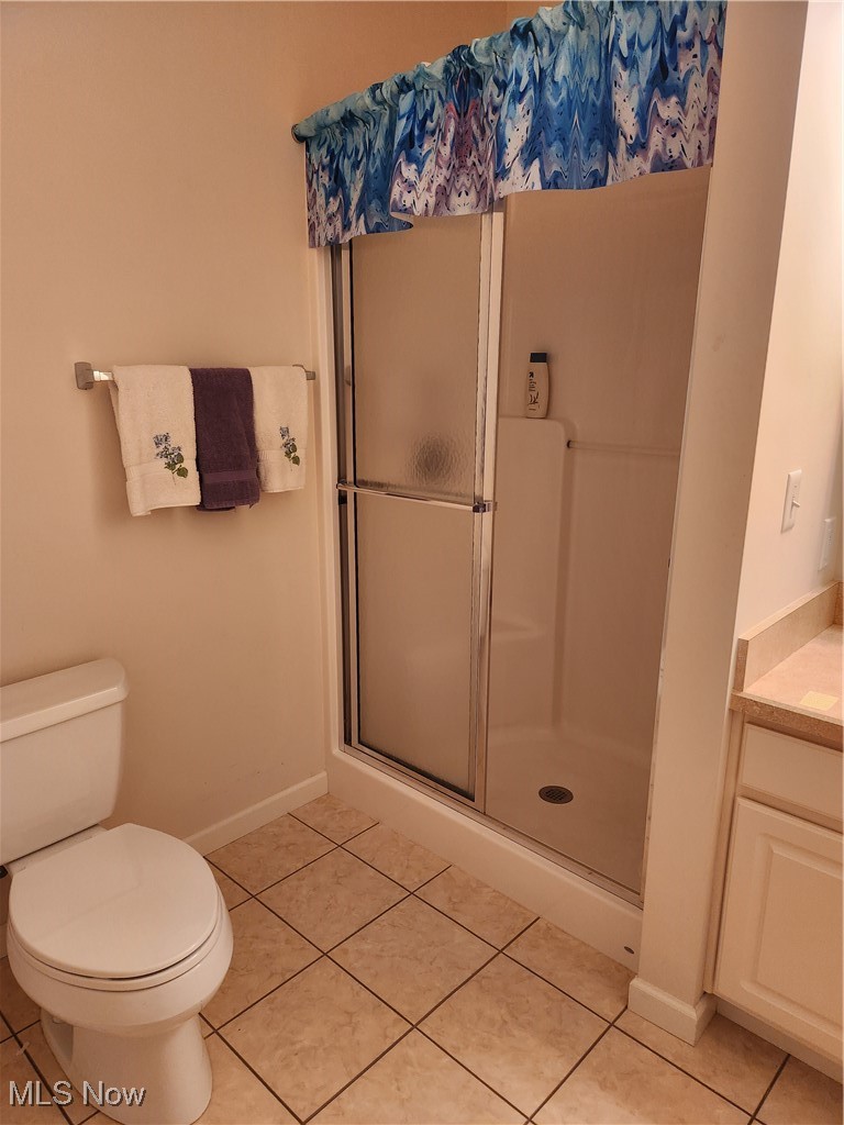5645 Clingan Road, Unit 18A Struthers, OH 44471 - Photo 33 of 38 Back Bedroom's full bathroom featuring a stall shower, tile patterned floors, and vanity