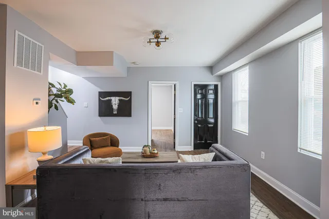 a living room with furniture and window
