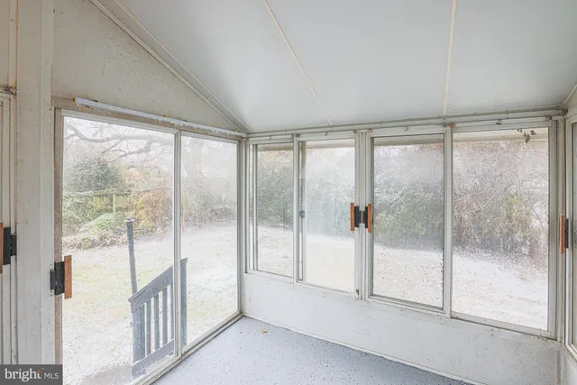 a view of hallway with wooden floor