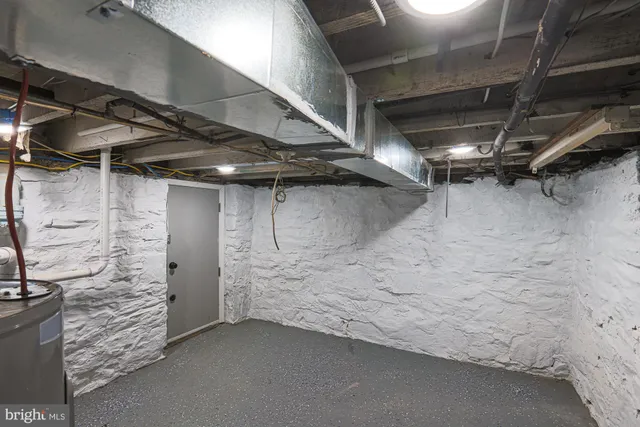 a bathroom with a toilet and a mirror