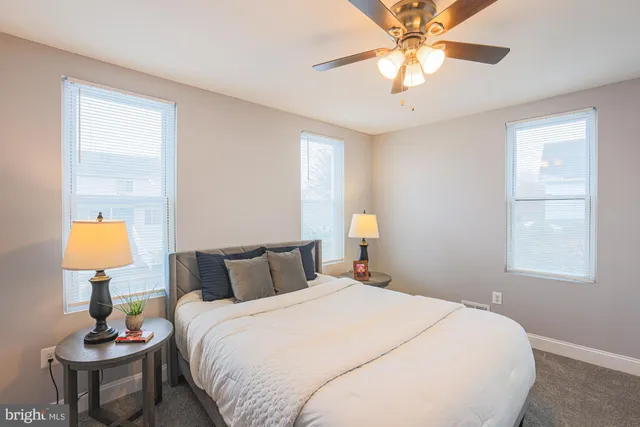 a bedroom with a bed and a lamp