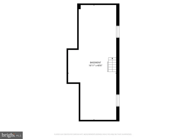 a picture of a bench in front of a wall