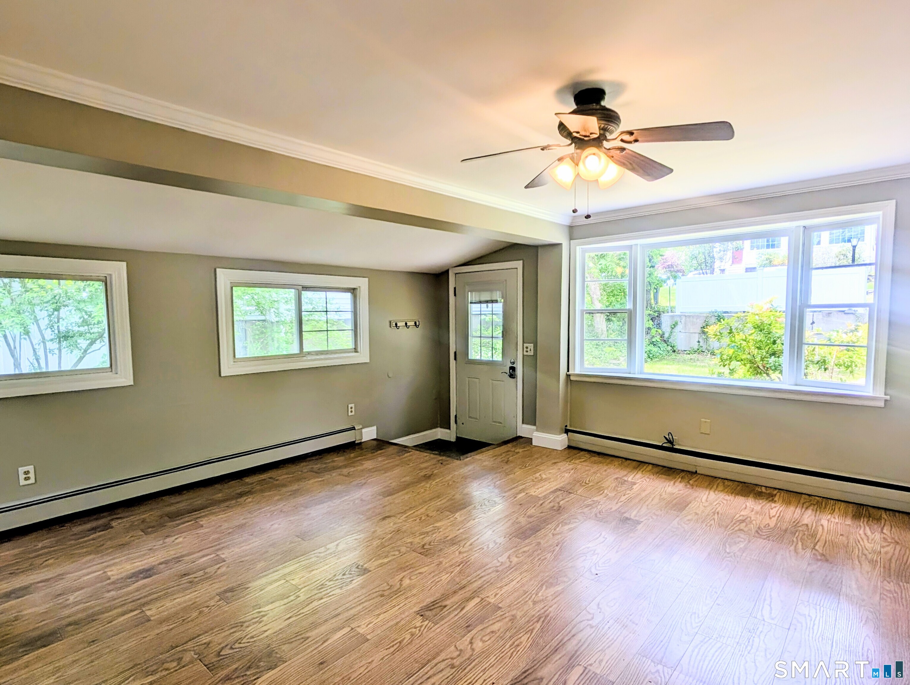 173 Daly Road Coventry, CT 06238 - Photo 9 of 27 Living room looking towards the front door. Notice the windows on the side and front of the home that flood this room with natural light.