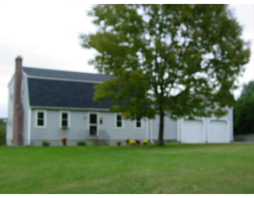 3 Prenier Road Charlton, MA 01507 - Photo 1 of 1 a backyard of a house with plants and large tree