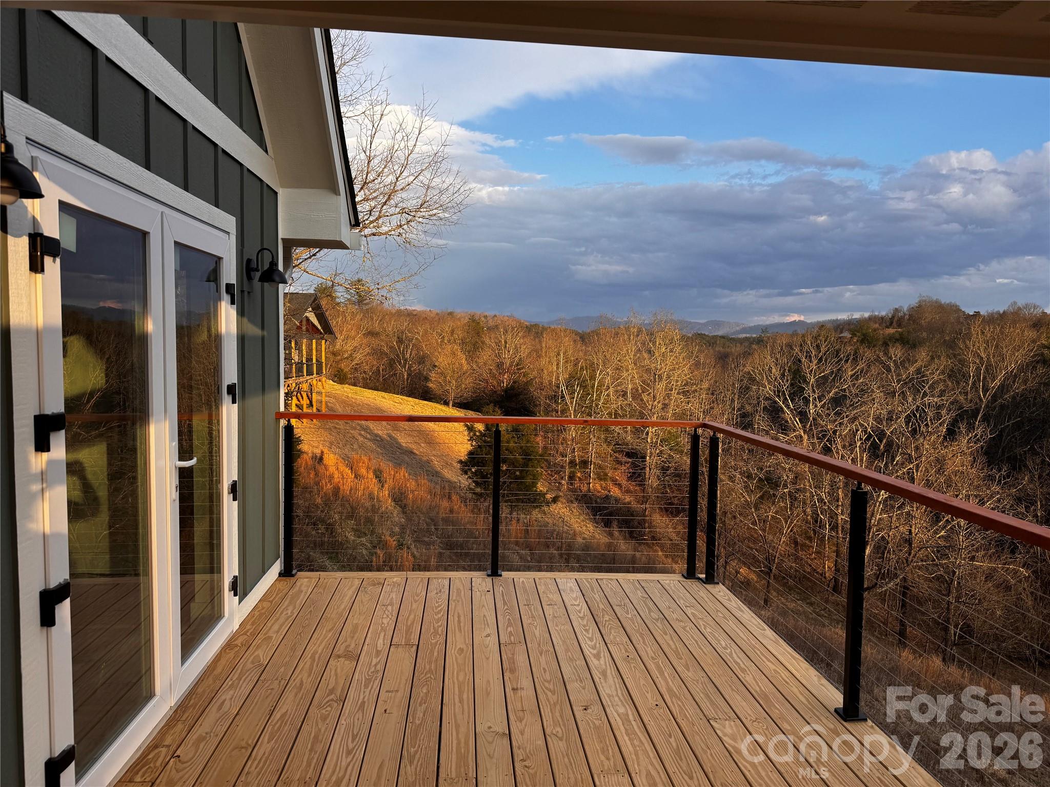 35 Firefly Ridge Trail, Unit 1 Alexander, NC 28701 - Photo 6 of 8 a view of balcony with wooden floor and lake view