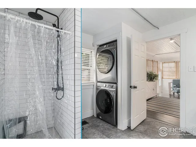 a view of a hallway with washer and dryer