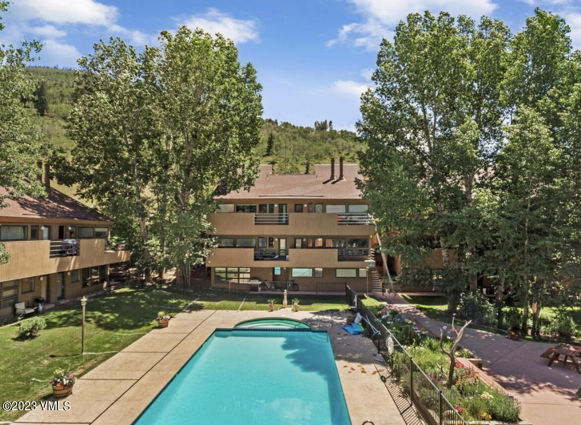3971 Bighorn, Unit 7N Vail, CO 81657 - Photo 15 of 19 a view of a house with swimming pool and sitting area