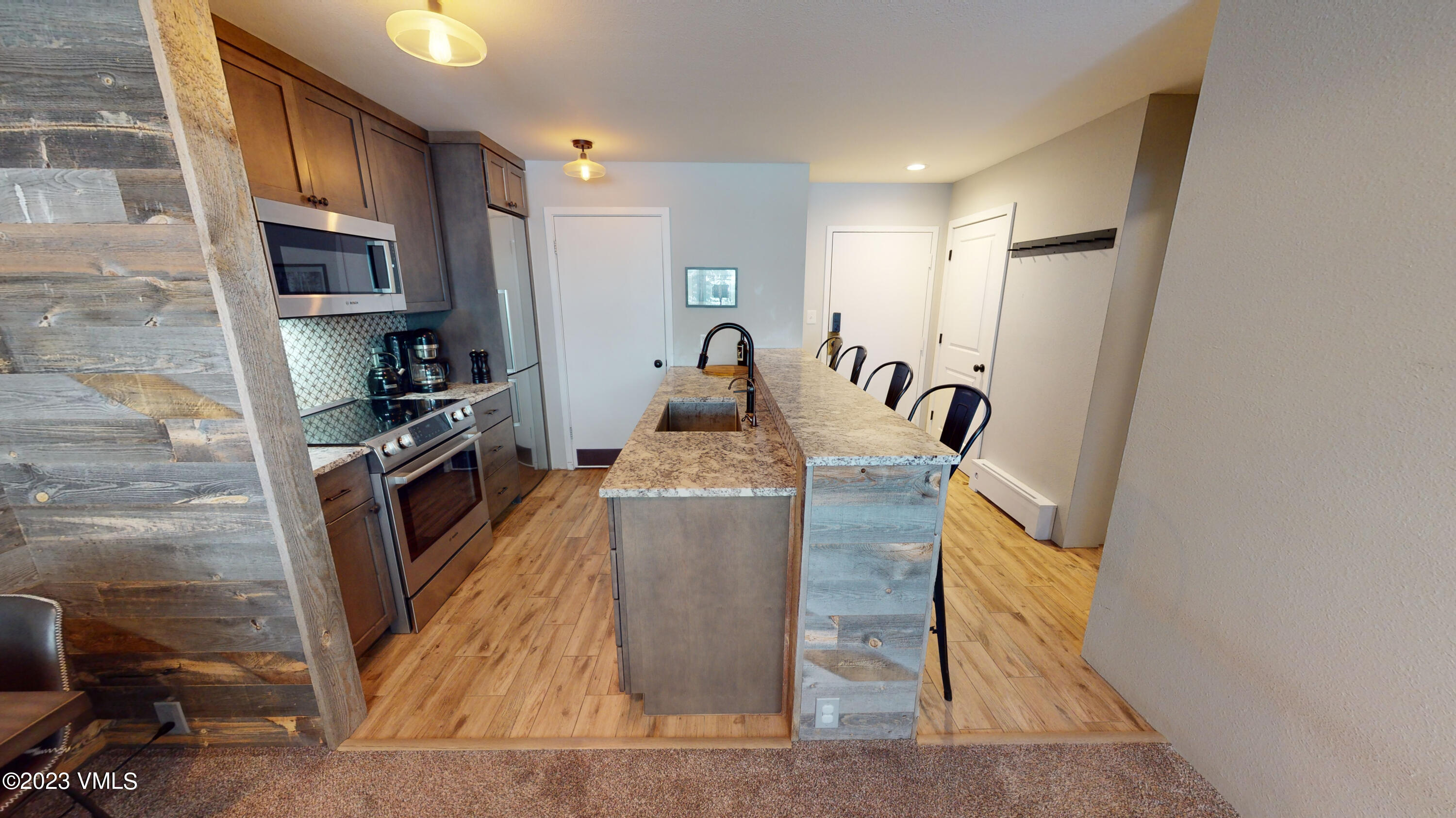 3971 Bighorn, Unit 7N Vail, CO 81657 - Photo 4 of 19 a kitchen with sink refrigerator and stove