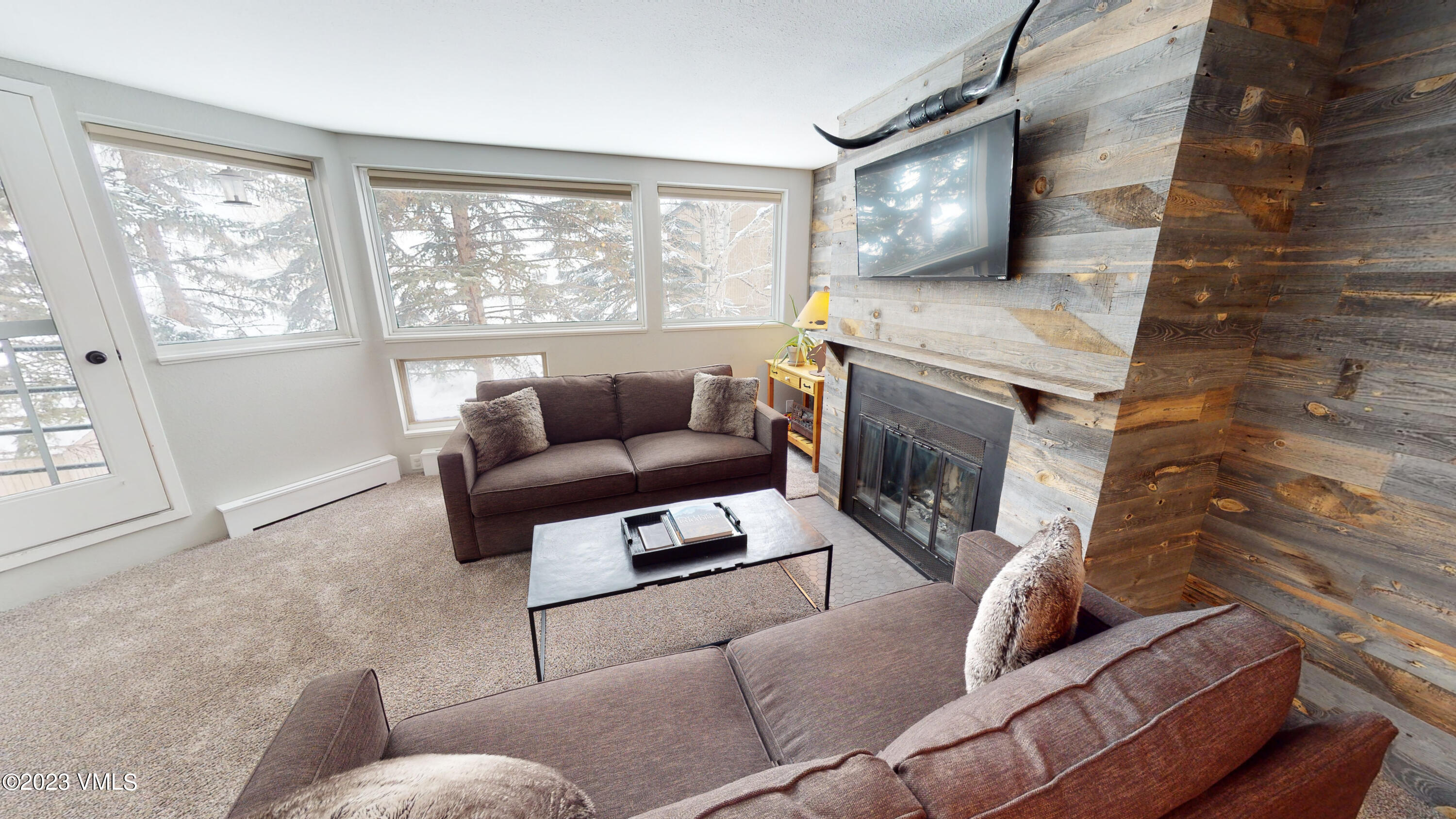 3971 Bighorn, Unit 7N Vail, CO 81657 - Photo 5 of 19 a living room with furniture and a fireplace