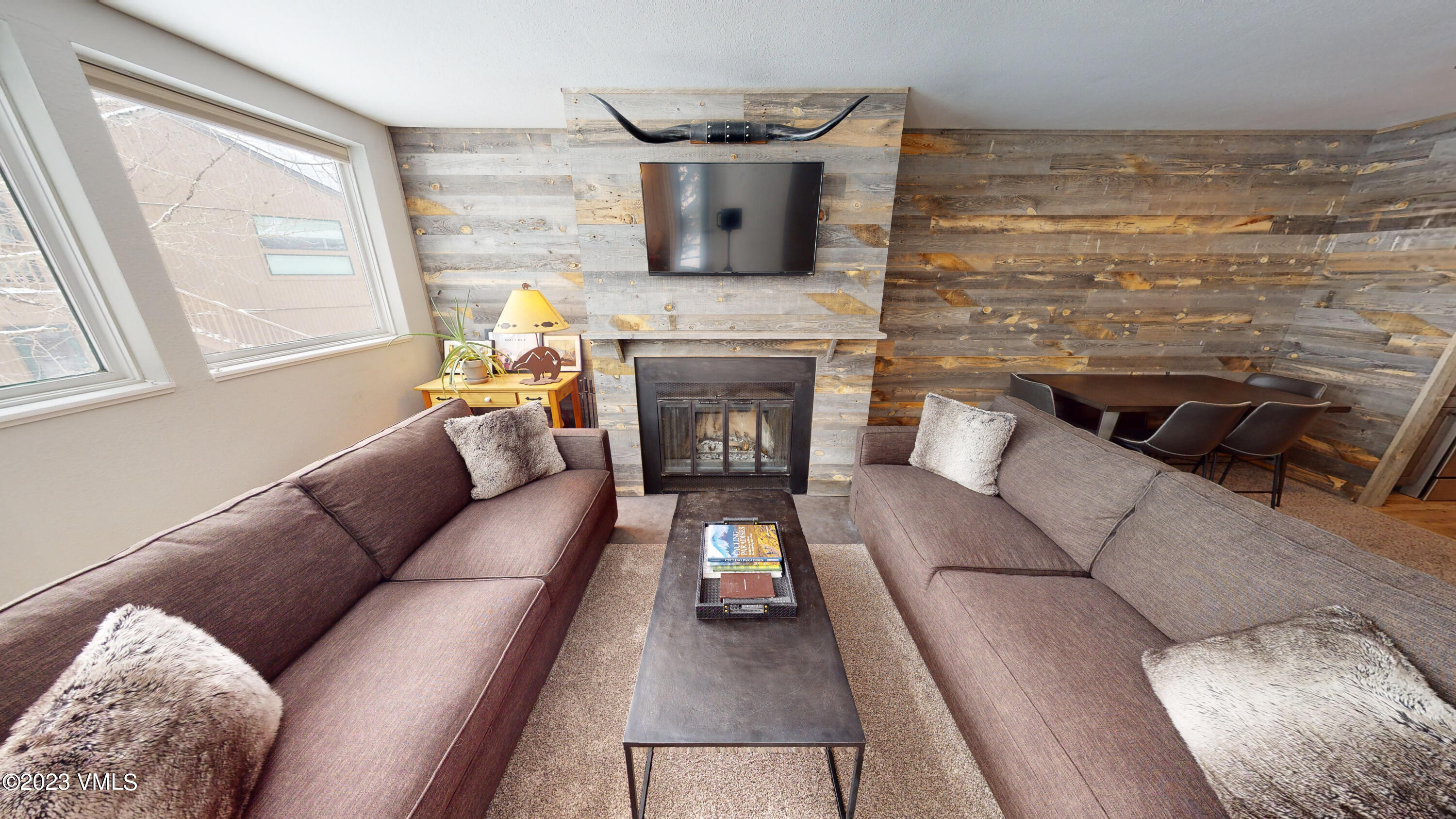 3971 Bighorn, Unit 7N Vail, CO 81657 - Photo 6 of 19 a living room with furniture and a fireplace