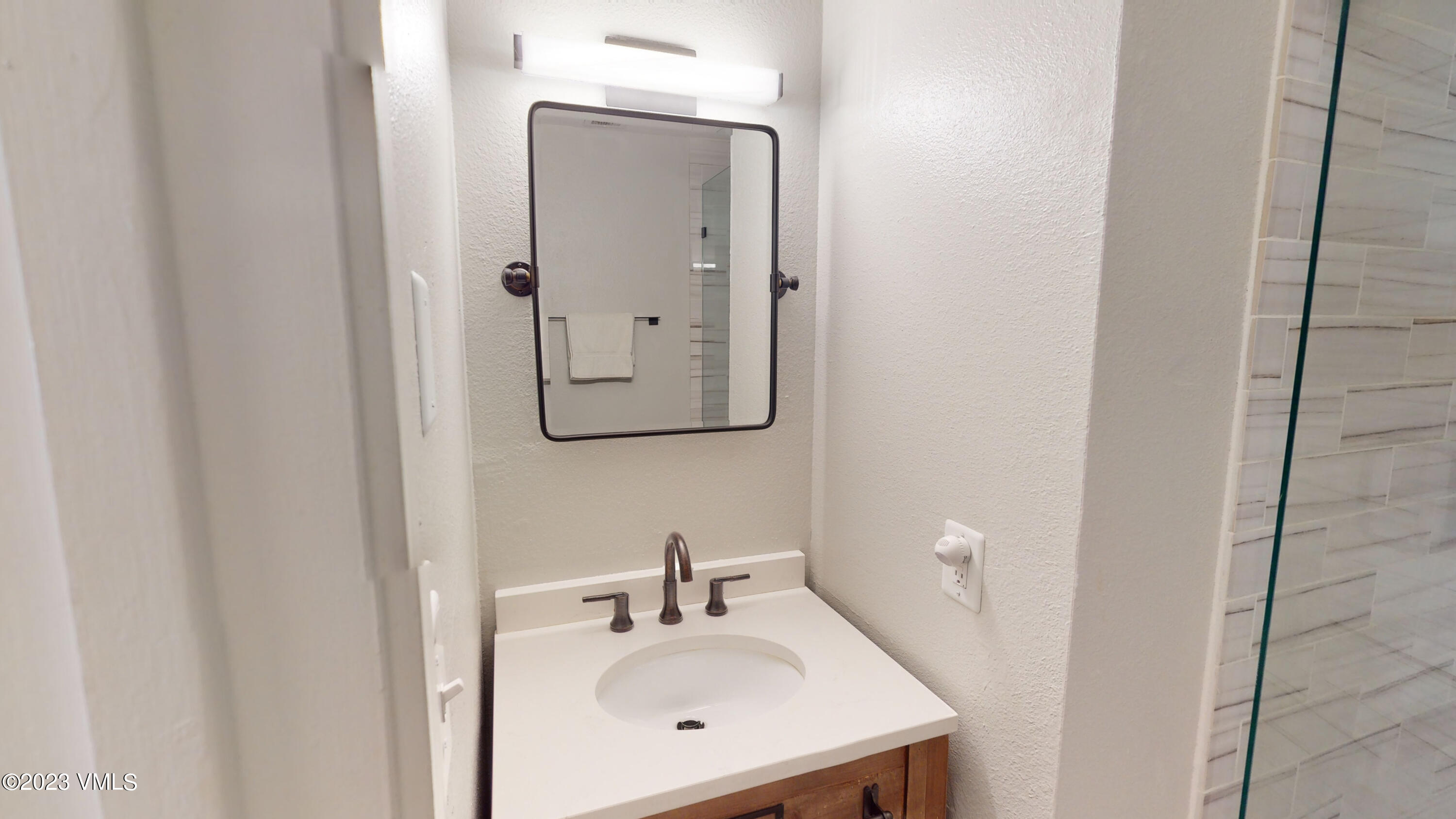 3971 Bighorn, Unit 7N Vail, CO 81657 - Photo 8 of 19 a bathroom with a sink and a mirror