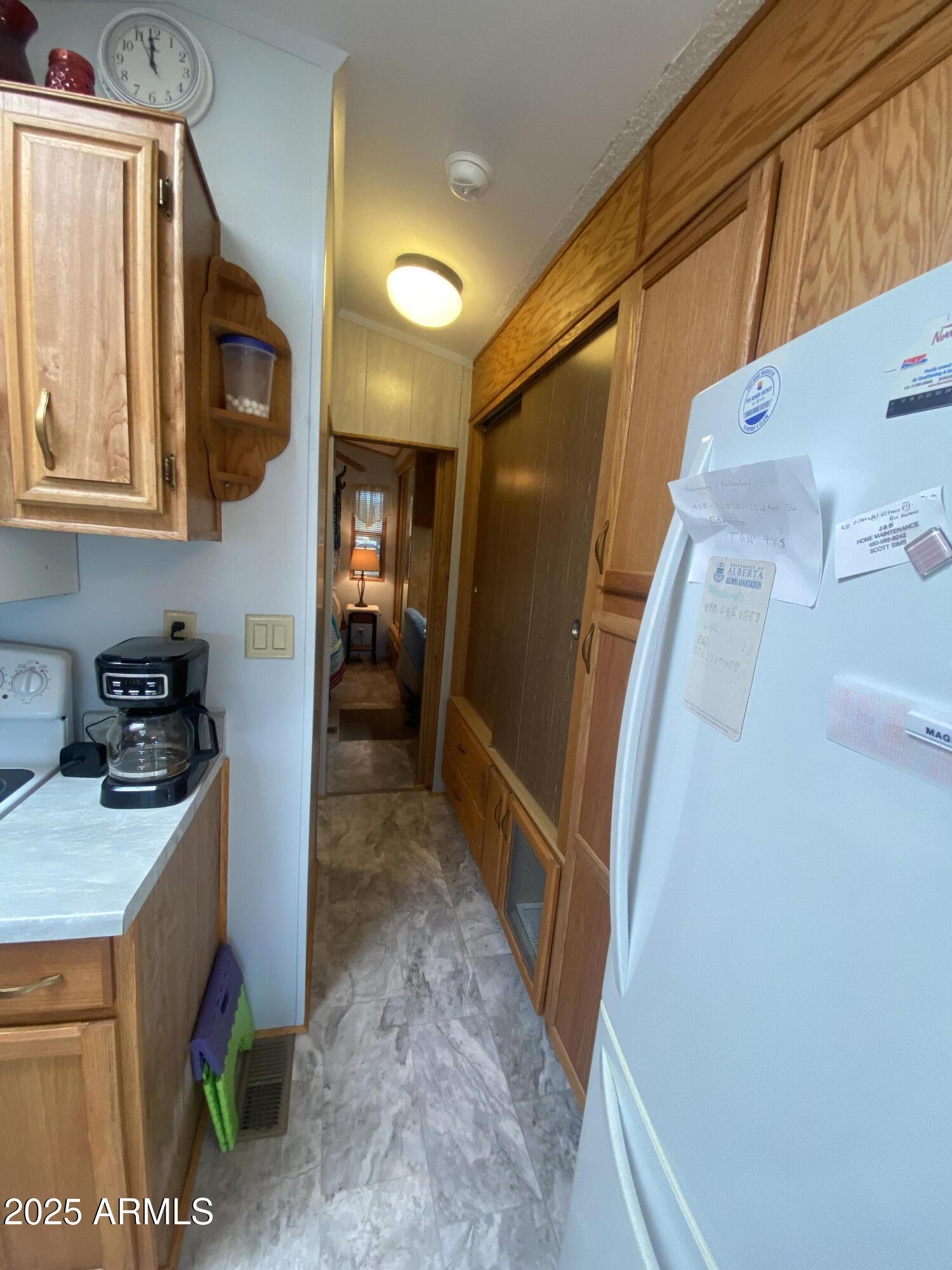 1177 Kiowa Circle Apache Junction, AZ 85119 - Photo 12 of 24 a hallway with washer and dryer