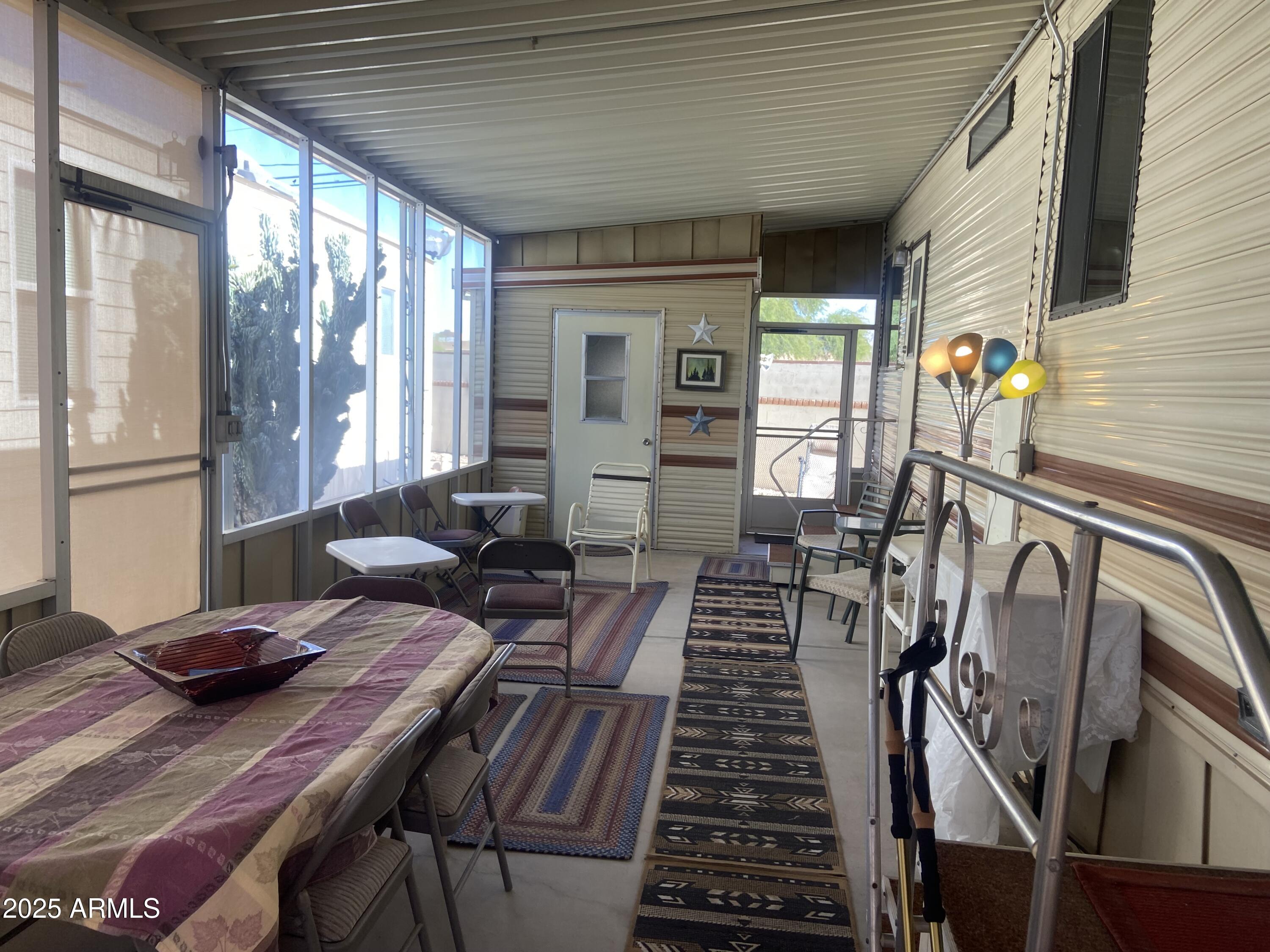 1177 Kiowa Circle Apache Junction, AZ 85119 - Photo 18 of 24 a view of a dining room with furniture window and outside view