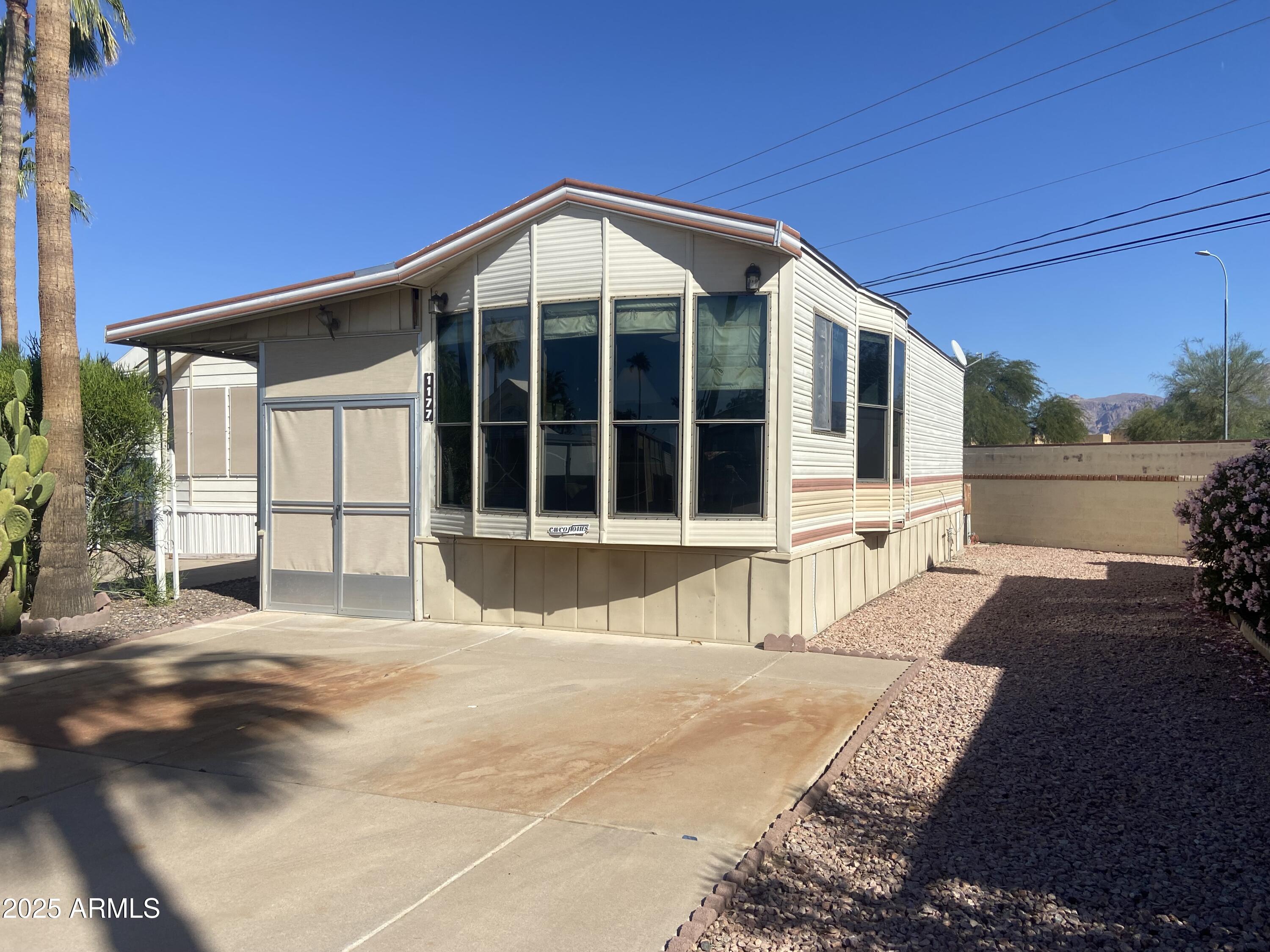 1177 Kiowa Circle Apache Junction, AZ 85119 - Photo 24 of 24 a view of a house with a swimming pool