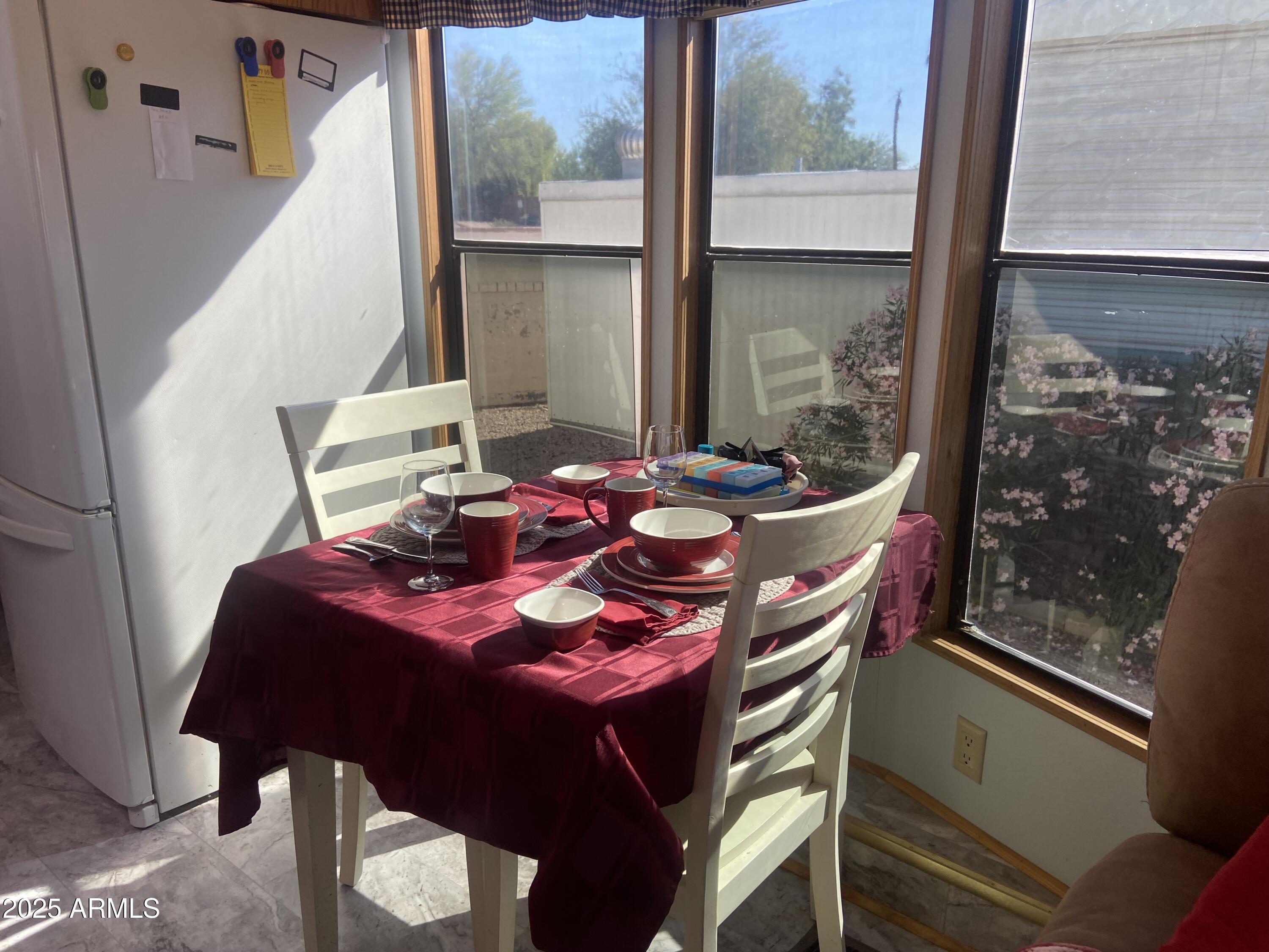 1177 Kiowa Circle Apache Junction, AZ 85119 - Photo 9 of 24 a dining room with furniture and window