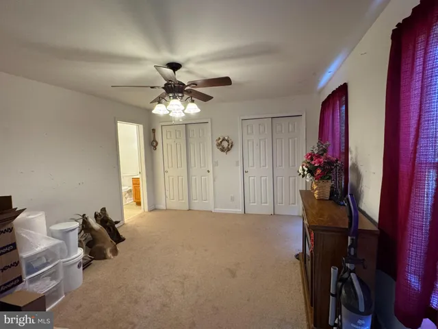 a view of a livingroom with furniture and a chandelier