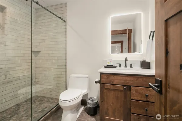 a bathroom with a sink toilet and shower