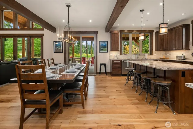 a view of a dining area with furniture window and outside view