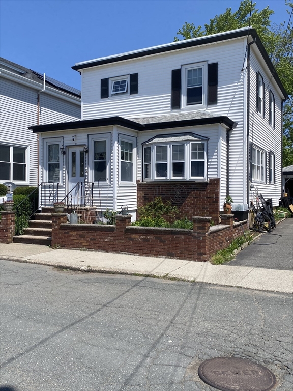 a front view of a house with yard