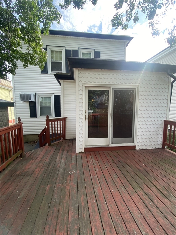 7 River St Place Lynn, MA 01905 - Photo 15 of 16 a view of backyard with a deck and wooden floor