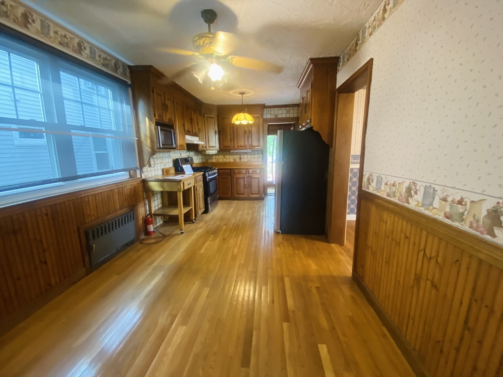 7 River St Place Lynn, MA 01905 - Photo 3 of 16 a view of a kitchen with furniture and a kitchen