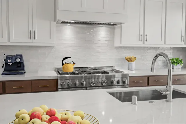 a kitchen with a stove and cabinets