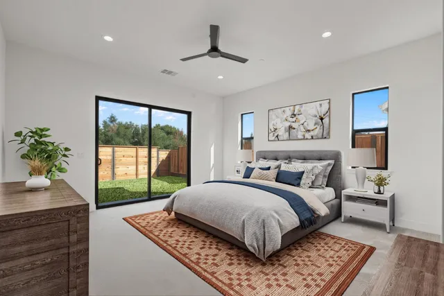 a bedroom with a large bed and a window