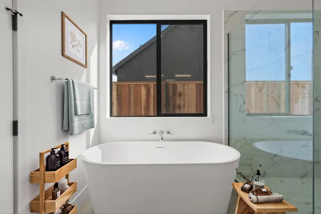 a bathroom with a bathtub and a shower