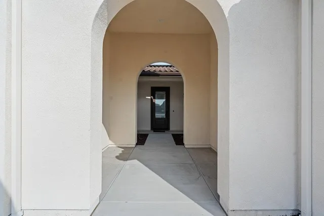 a view of a livingroom with a and white door