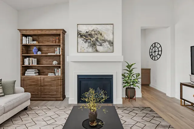 a living room with furniture and a fireplace