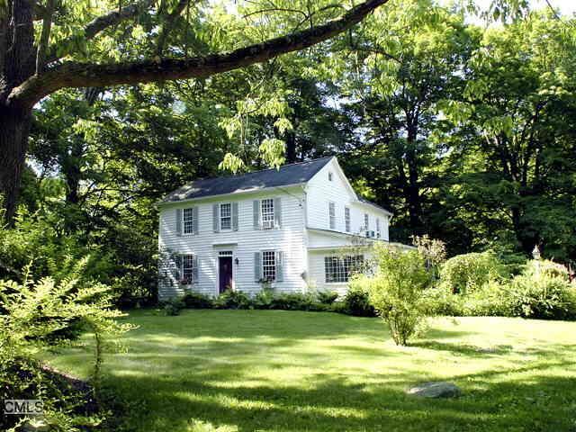 573 Redding Road Redding, CT 06896 - Photo 1 of 1 a front view of a house with a yard