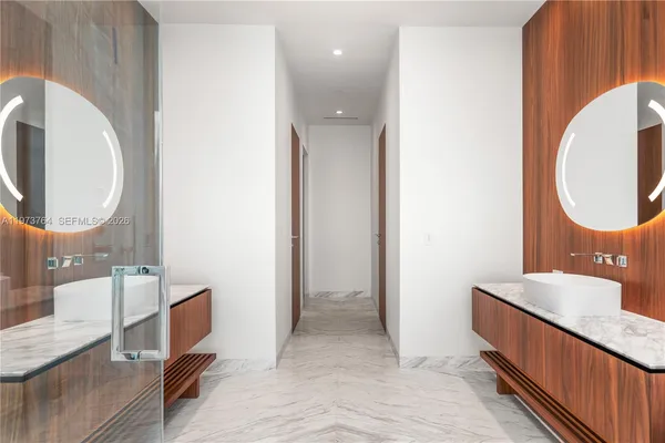 a bathroom with a double vanity sink and a mirror