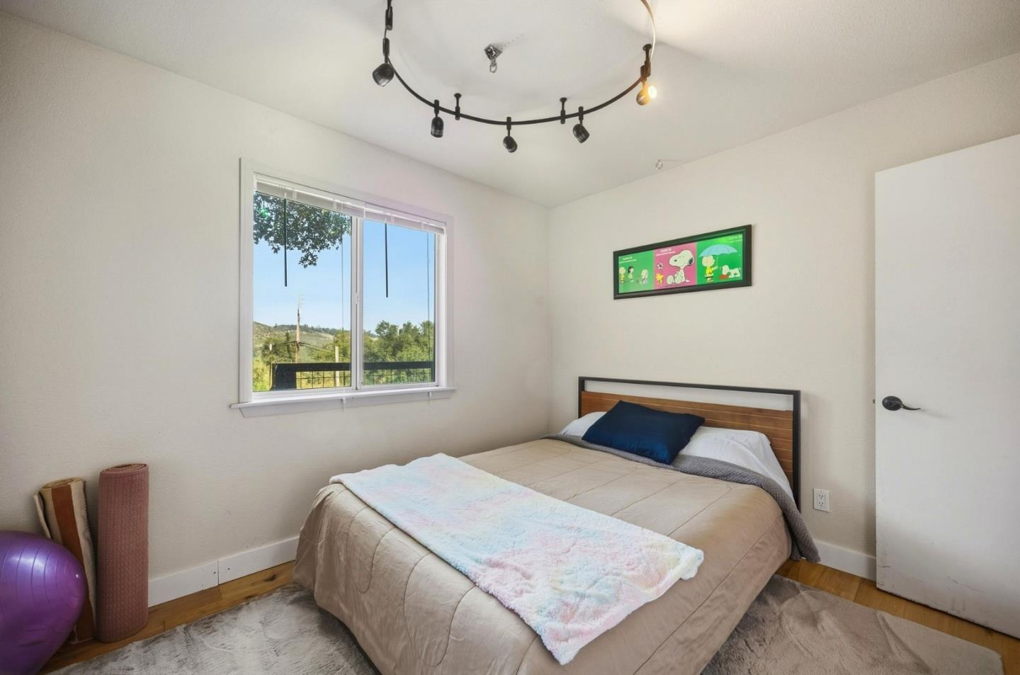 2353 Stagecoach Canyon Road Pope Valley, CA 94567 - Photo 14 of 46 a bedroom with a bed and a chair