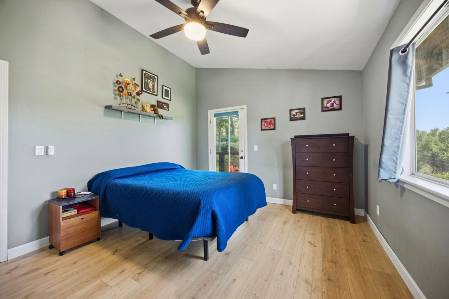 2353 Stagecoach Canyon Road Pope Valley, CA 94567 - Photo 18 of 46 a bedroom with a bed and a chandelier