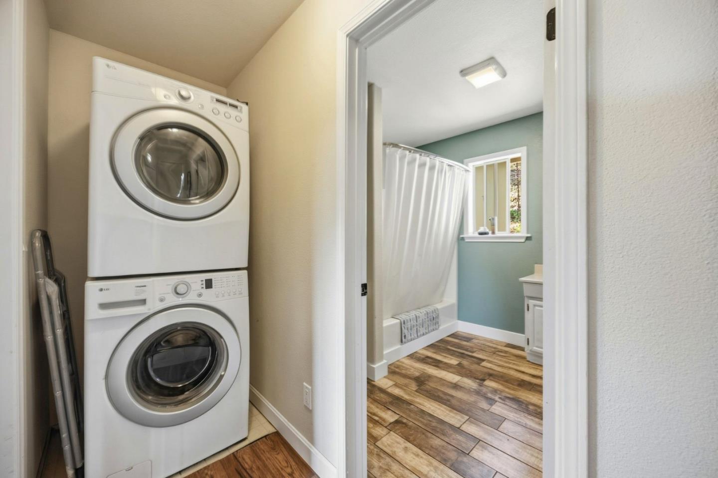 2353 Stagecoach Canyon Road Pope Valley, CA 94567 - Photo 22 of 46 a view of a hallway with washer and dryer