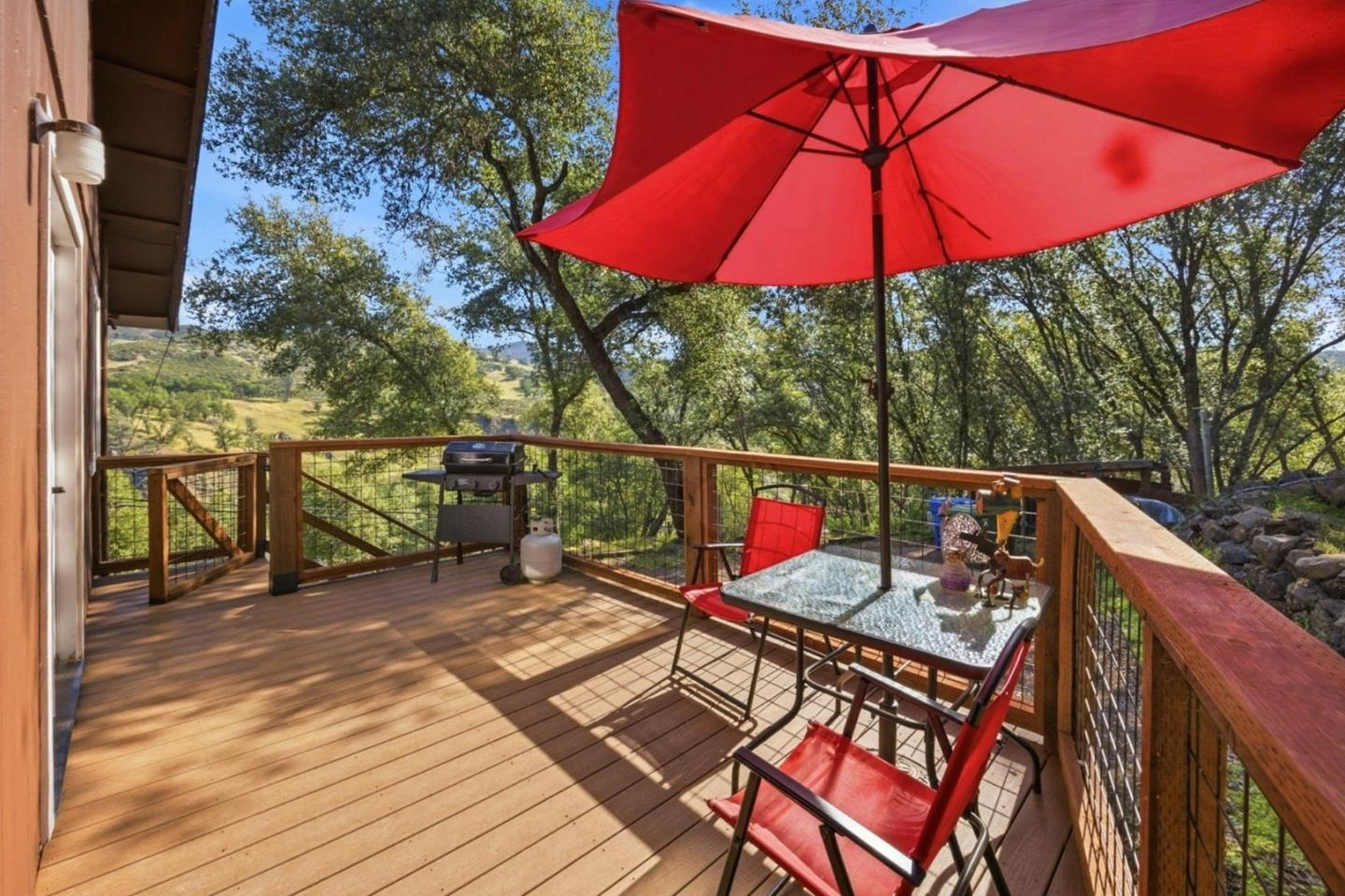 2353 Stagecoach Canyon Road Pope Valley, CA 94567 - Photo 27 of 46 a view of deck with furniture and umbrella