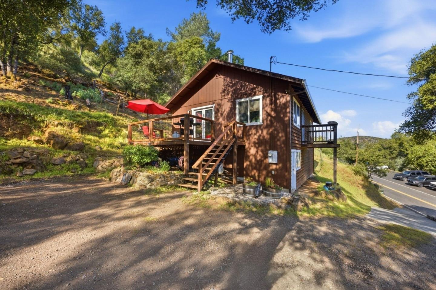2353 Stagecoach Canyon Road Pope Valley, CA 94567 - Photo 3 of 46 a view of a wooden house with a yard