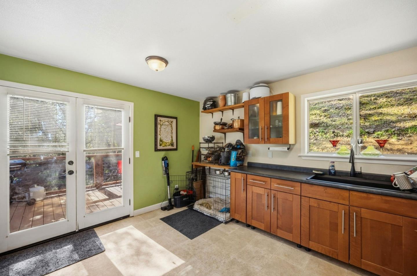 2353 Stagecoach Canyon Road Pope Valley, CA 94567 - Photo 10 of 46 a kitchen with a sink and wooden cabinets