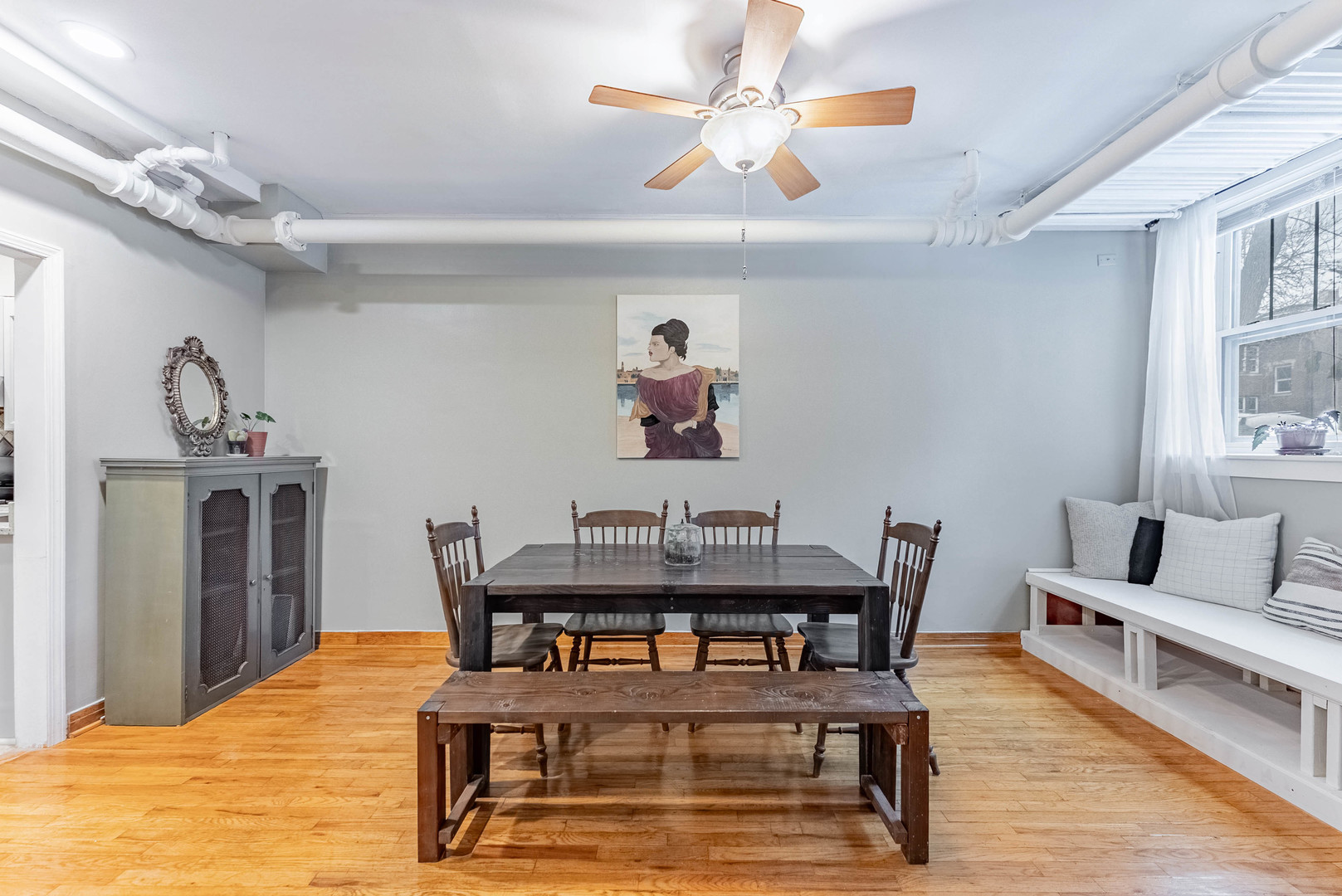 6430 North Glenwood Avenue, Unit G4 Chicago, IL 60626 - Photo 9 of 33 a view of a dining room with furniture and wooden floor