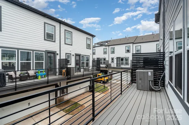 a view of a house with pool and wooden floor
