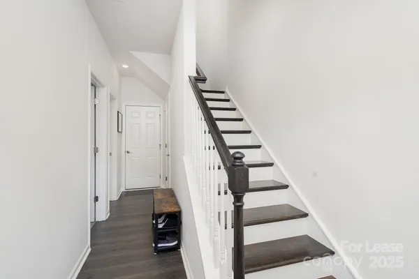 a view of entryway with wooden floor