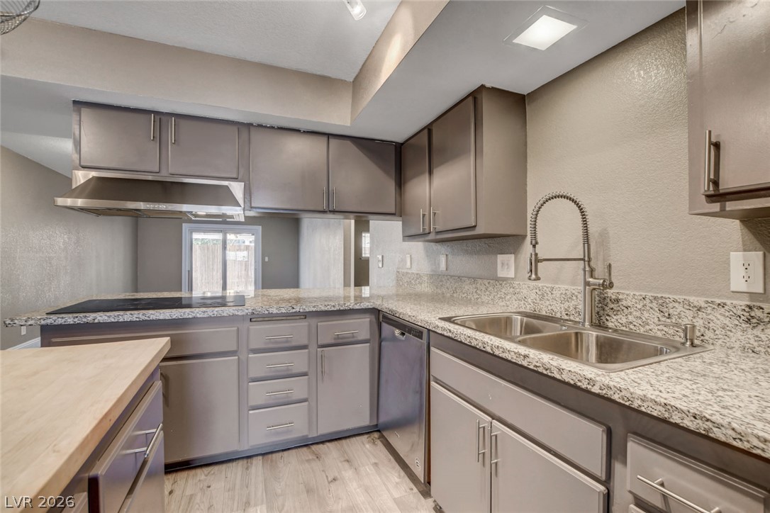 4367 South Mojave Road Las Vegas, NV 89121 - Photo 23 of 53 Granite counters and light wood flooring define this freshly appointed kitchen space.