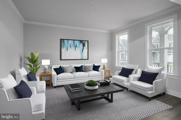a living room with furniture potted plant and window