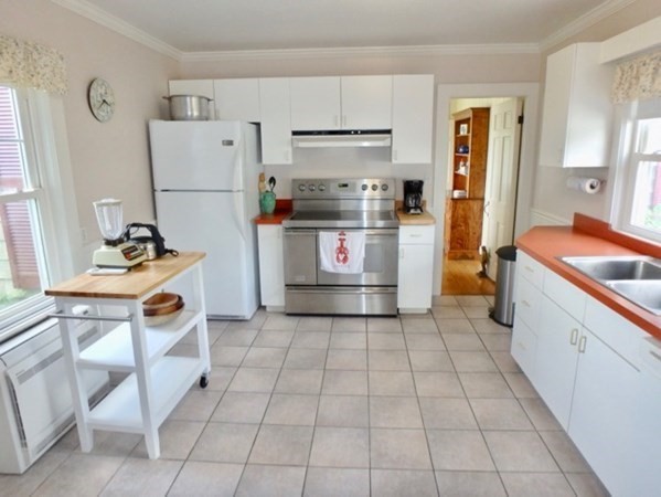 17 Edgartown Bay Road Edgartown, MA 02539 - Photo 19 of 31 a kitchen with stainless steel appliances granite countertop a refrigerator and a stove