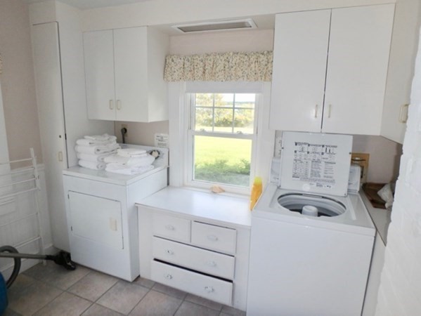 17 Edgartown Bay Road Edgartown, MA 02539 - Photo 20 of 31 a view of cabinets a washer and dryer
