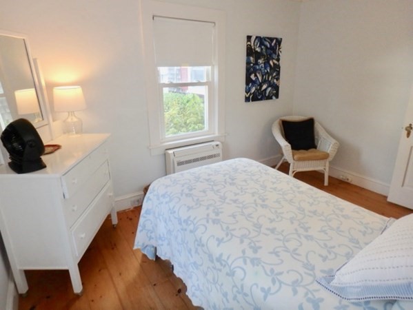 17 Edgartown Bay Road Edgartown, MA 02539 - Photo 25 of 31 a bedroom with a bed and wooden floor