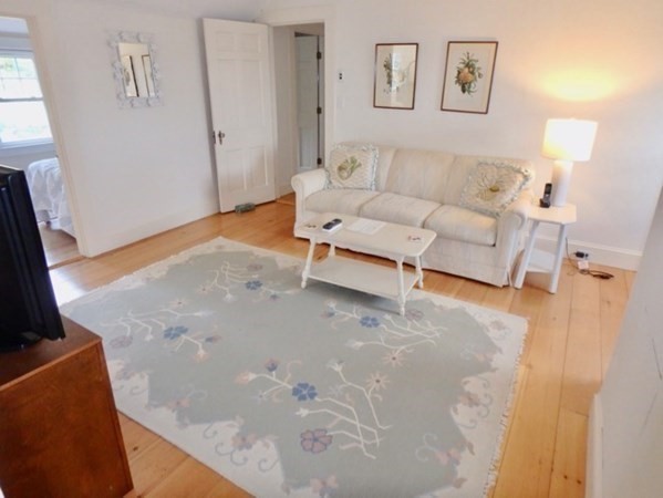 17 Edgartown Bay Road Edgartown, MA 02539 - Photo 28 of 31 a living room with furniture and a flat screen tv
